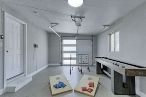 Play cornhole or shuffleboard!