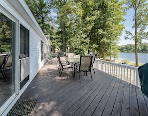 Lake facing deck with patio dining furniture & gas grill