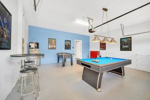 The home features a pool table and seating for hours of family fun 