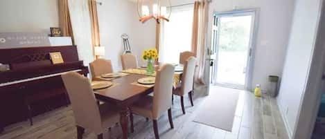 Formal dining room with a piano 