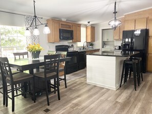 Full size kitchen with plenty of seating.  Equipped with all of the kitchen basics that you need. 