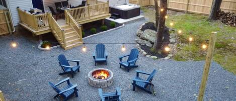 Enjoy the back yard deck, fire pit and hot tub!