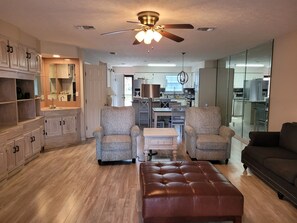 Spacious living area; lots of storage for long stays. 2  recliners & sofa. 