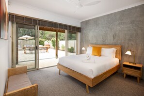 The queen bedroom with direct pool access also boasts a spacious en-suite.