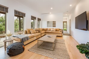 A movie night with the entire family is easily accommodated by the L-shaped couch in the second lounge.