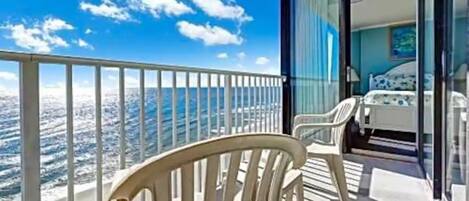 Beautiful ocean front condo (sleeps 6) just one story off the beach