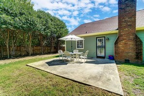 Backyard is surrounded by mature trees which provides privacy. Yard is not fenced.
