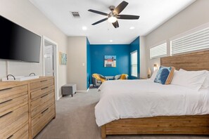 Drift into relaxation in a spacious bedroom with a luxurious king bed, premium linens, and a serene ambiance for the perfect night’s sleep.