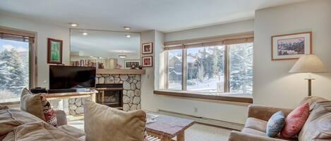 Living Room - A gorgeous space with rockface gas fireplace and flat screen TV... OH, and those VIEWS!