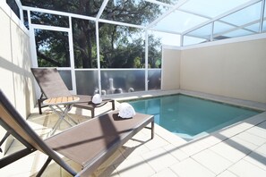 Cool off in the private splash pool with sun loungers and views over gardens