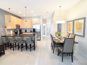 Formal dining area to seat 6 next to the fully equipped kitchen, breakfast bar