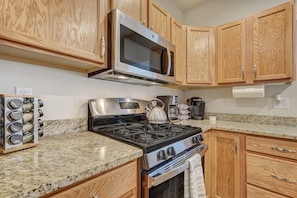 Spacious and fully stocked kitchen with a large island for gathering around and having fun while cooking!