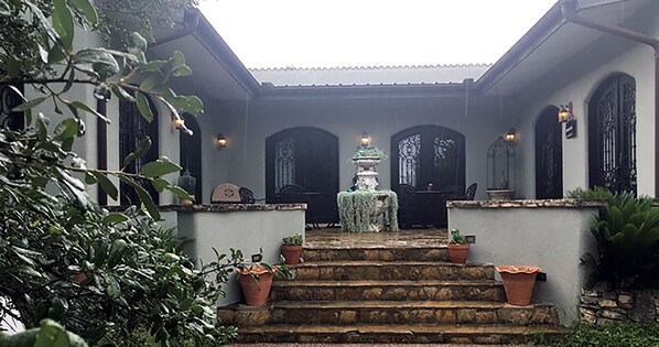 The courtyard of The Wizard's Guest Cottage faces a fabulous private garden.