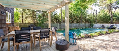 Private yard with pergola, heated pool, sun deck, fire ring & new landscaping 