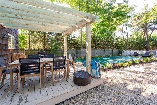 Private yard with pergola, heated pool, sun deck, fire ring & new landscaping 