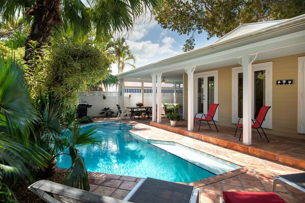 Private backyard with pool and lush gardens