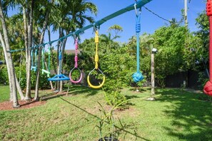 Watch as joy unfolds in our backyard playground, the perfect place for kids to play and explore under the Miami sun.