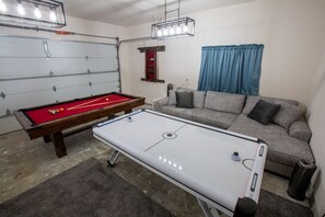 Game room with pool table and air hockey for hours of entertainment