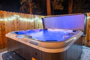 Relax in the hot tub under open starry skies!