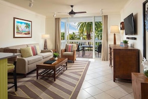 Spacious living room with furnished balcony.