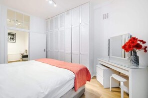Experience ultimate comfort in the bedroom, featuring a luxurious king-size bed and individual air conditioning for personalized climate control. Stay organized with built-in storage options and a convenient dresser, ensuring a restful and comfortabl