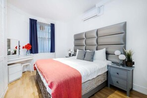 Experience ultimate comfort in the bedroom, featuring a luxurious king-size bed and individual air conditioning for personalized climate control. Stay organized with built-in storage options and a convenient dresser, ensuring a restful and comfortabl