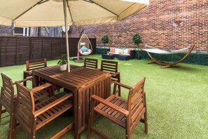 Enjoy our private garden with seating, dining, swing egg chair, and hammock.