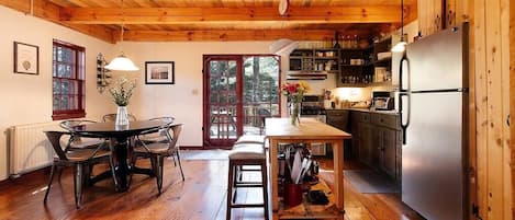 Kitchen and dining area with view to the back deck