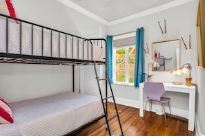 The 3rd bedroom has a twin bunk bed and personal desk and chair for remote students or workers. A lovely small space perfect for kids or tweens.