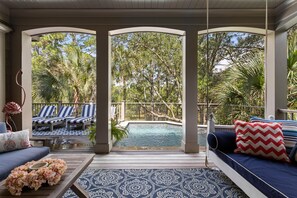 View of pool from covered deck