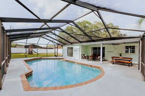 Screened in lanai lounge area with 2 added sun loungers (not pictured) 