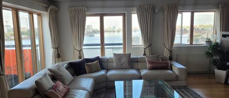 Huge open plan living room - views of the river from all windows 