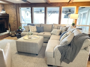 Living area with wall to wall windows.