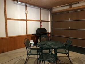 Table and grill for you to use in the garage.