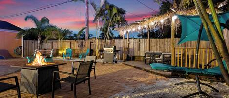 This outdoor space is like no other! Firepit, multiple seating areas, lighted water feature, sanded 'beach' areas, and more!