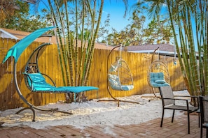 Lay back and relax on one one of the many outdoor chairs and swings.