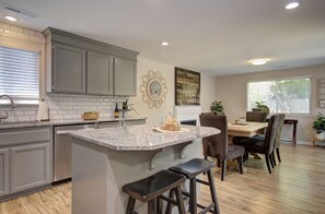 Open concept kitchen and dinning room with seating for 8