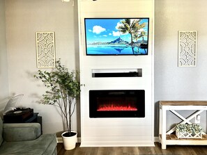 Living room with electric fireplace to ensure warm vacation feel