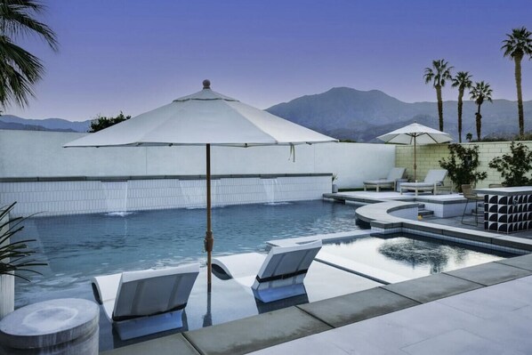 Relax and unwind in this luxurious backyard paradise.