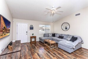 Living areas with Comfortable sectional eating and mart TV with Netflix and YouTube