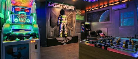 Discover endless fun at the Buzz Lightyear Arcade, featuring classic games, a basketball challenge, and cozy seating. Unleash your inner space ranger and create unforgettable memories! #GalacticAdventure️