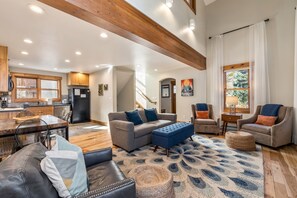 Living room with kitchen in background