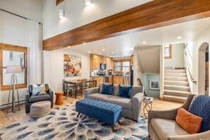 Living room with kitchen in background