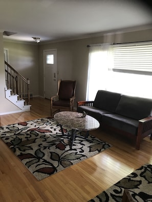 Formal living room set up to have 10 people sit around and chat!