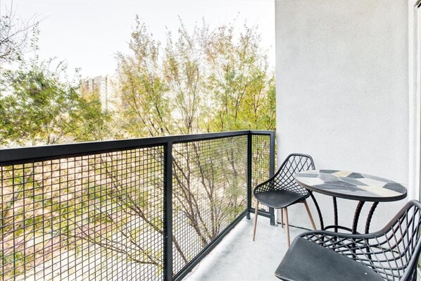 Revel in the outdoors! Our balcony offers a cozy and inviting space to relax."