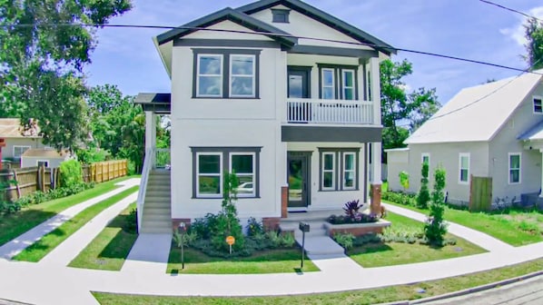 Front of the home with private driveway on the left 