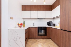 The fully equipped kitchenette includes everything you need for a home-cooked meal.
