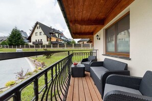 The balcony provides a perfect spot for enjoying the fresh air and mountain view.