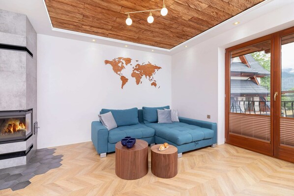 Relax in the stylish living room with a comfortable sofa and cosy decor.