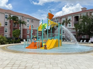 Water playground for the kids, at the pool area right outside our condo